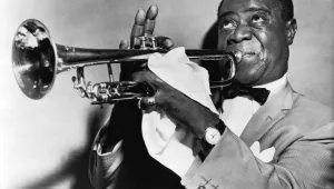 Форест Уитакър играе Луис Армстронг 